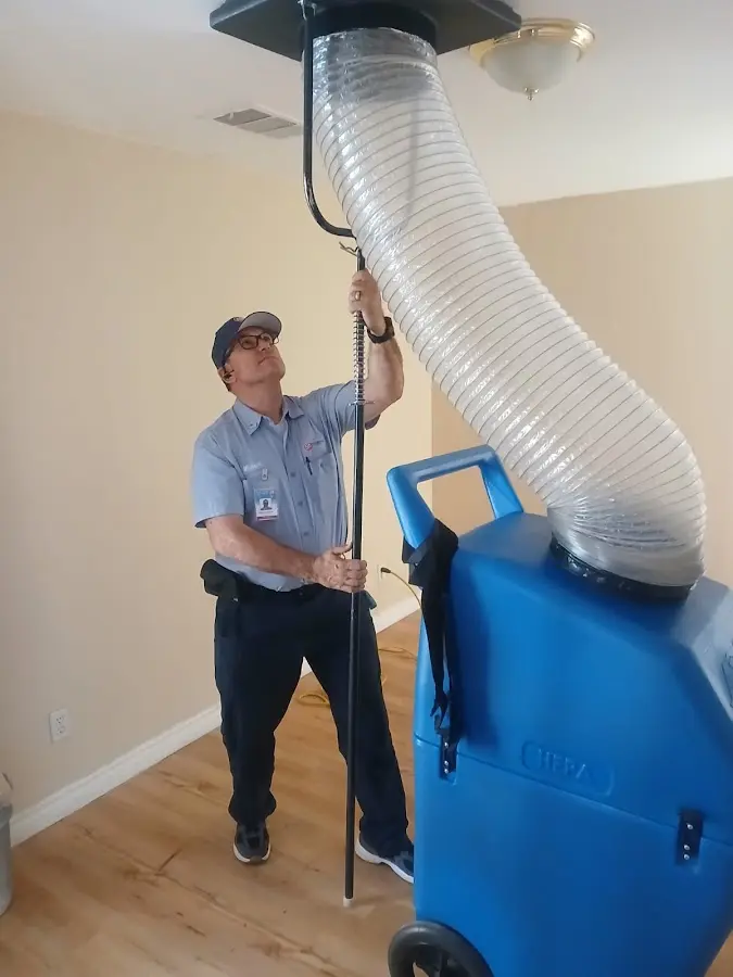 Furnace Tune-Up technician using HEPA equipment in Piedmont